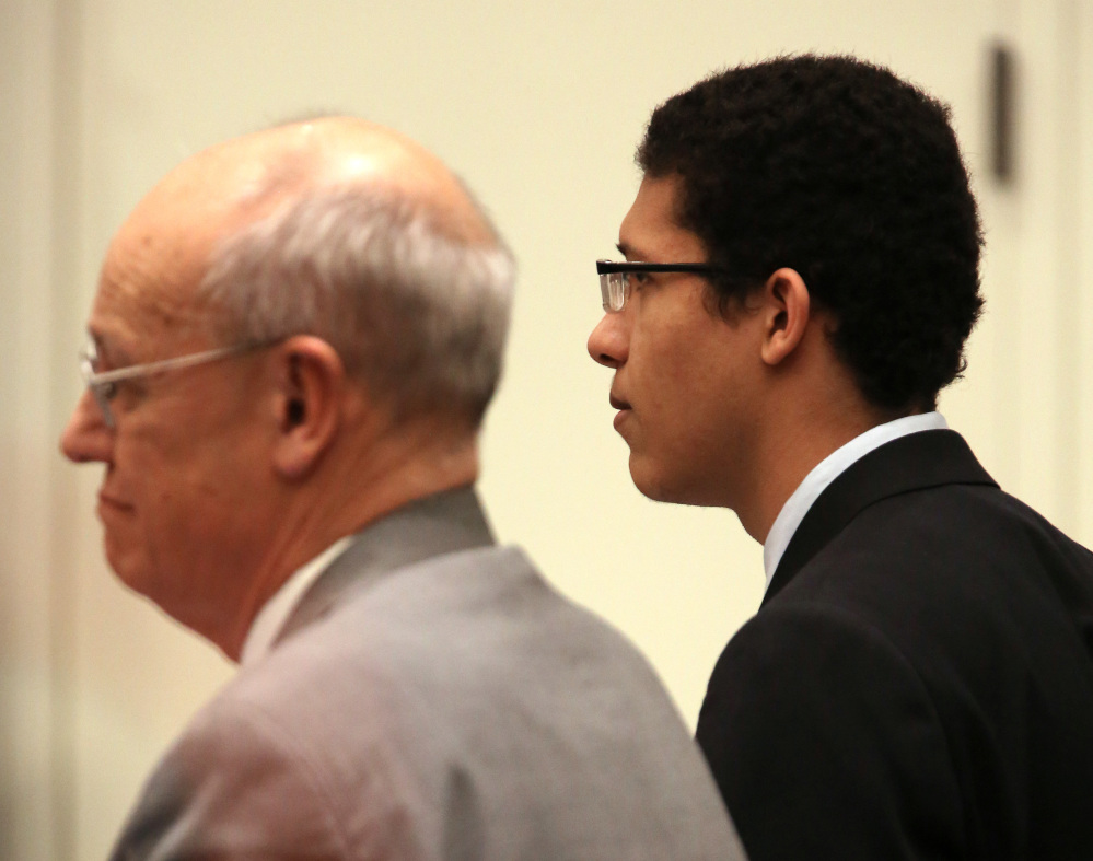 Philip Chism, right, stares straight ahead beside defense attorney John Osler as the jury reads the verdict Tuesday in his trial in Salem Superior Court. Chism was convicted in the 2013 murder and rape of Colleen Ritzer, a 24-year-old math teacher at Danvers High School.