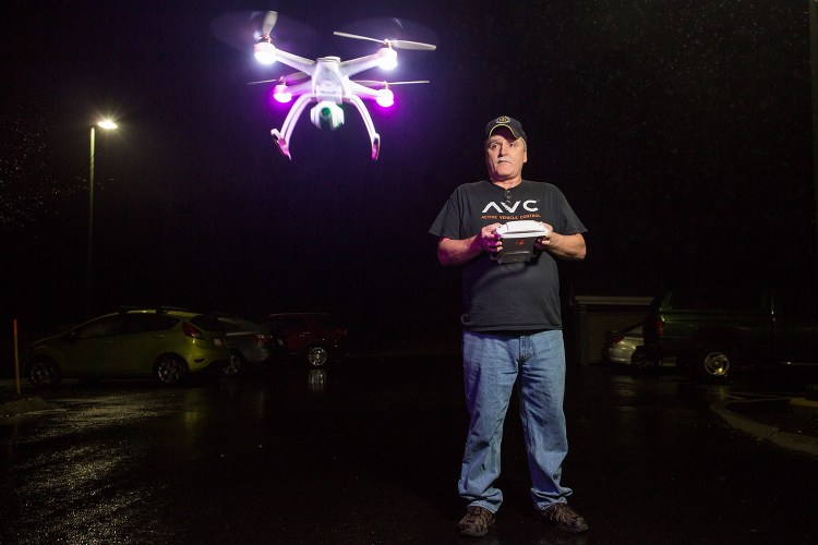 Burt Dumond, part-owner of Ray & Robin's Hobby Center in Falmouth, flies a Blade Chroma Camera Drone in the parking lot of the store Monday. The Federal Aviation Administration announced that individuals will have to register their drones with the FAA before Feb. 19.
Gabe Souza/Staff Photographer