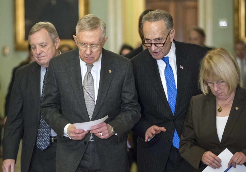 Senate Minority Whip Richard Durbin, D-Ill., from left, Senate Minority Leader Harry Reid, D-Nev., Sen. Charles Schumer, D-N.Y., and Sen. Patty Murray, D-Wash., leave a Democratic caucus lunch Tuesday.