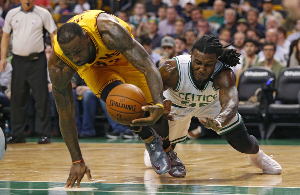 LeBron James scoops the ball away from the Celtics’ Jae Crowder on a play in the first quarter. James led Cleveland with 24 points.