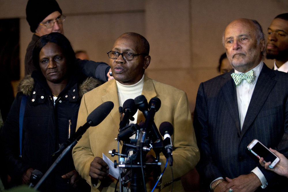 Freddie Gray’s stepfather, Richard Shipley, center, with Gray’s mother, Gloria Darden, and lawyer Billy Murphy, speaks to the media after a mistrial was declared Wednesday in the manslaughter trial of Officer William Porter. Officials appealed for calm as small crowds protested after the mistrial was declared.