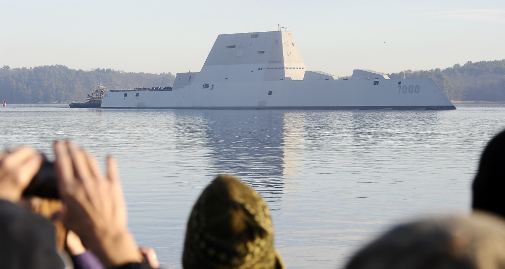 A crowd watches as the Zumwalt launches from Bath Iron Works on Dec. 7 for sea trials and heads down the Kennebec River to the ocean at Popham Beach.