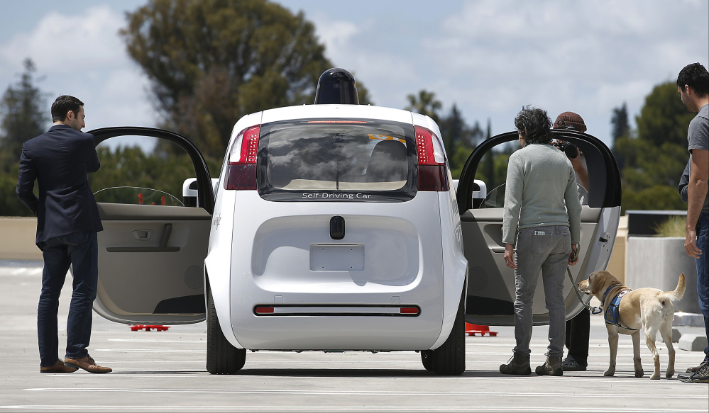 In May, Google gave demonstrations at its Mountain View, Calif.,  campus of its new self-driving car. Wednesday, California presented rules to slow public access to the cars.
