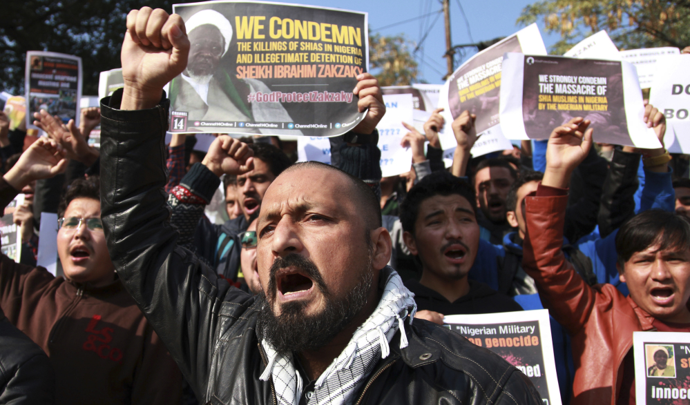Muslim students in Jammu, India, protest Tuesday against the Nigerian government after the alleged military massacre of hundreds of Shiite Muslims in Zaria.