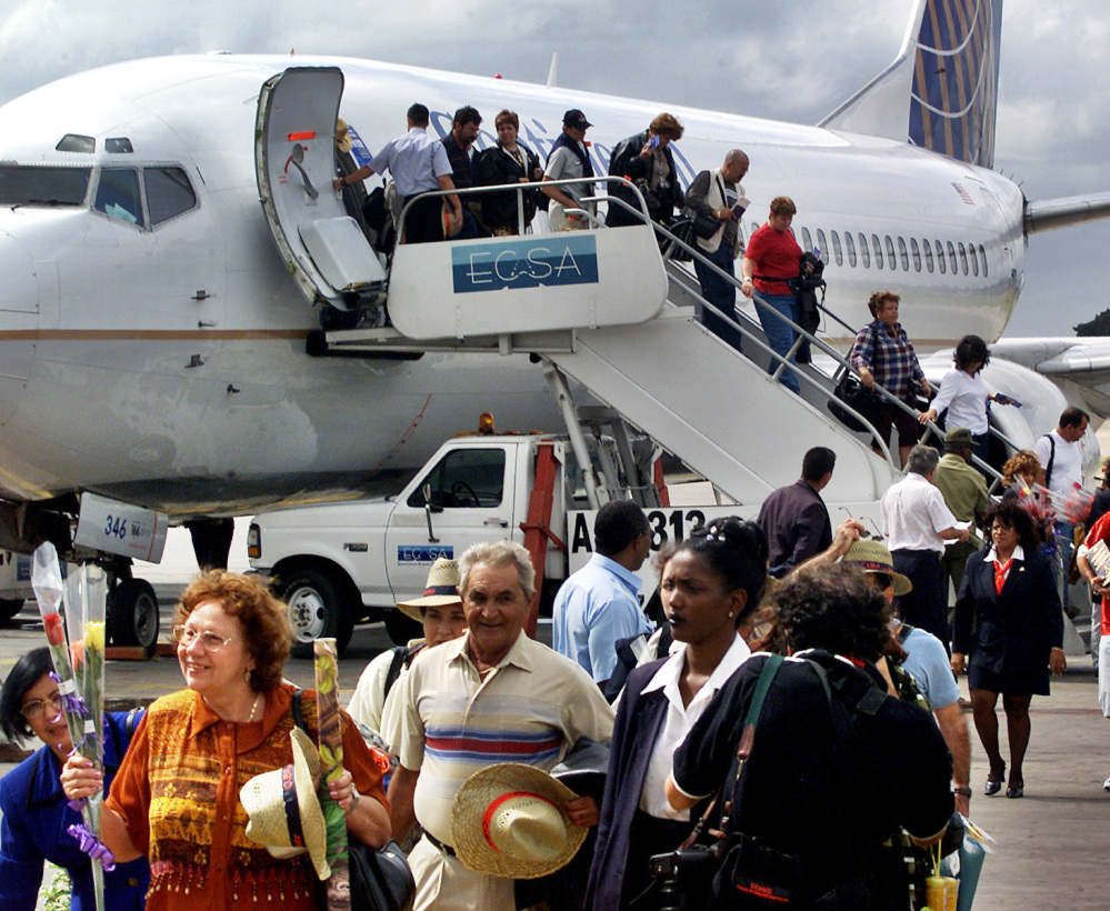 Passengers on the first flight of Continental Airlines from Miami to Havana arrive at Jose Marti International Airport on Nov. 1, 2001. The U.S. and Cuba say an aviation deal is near.