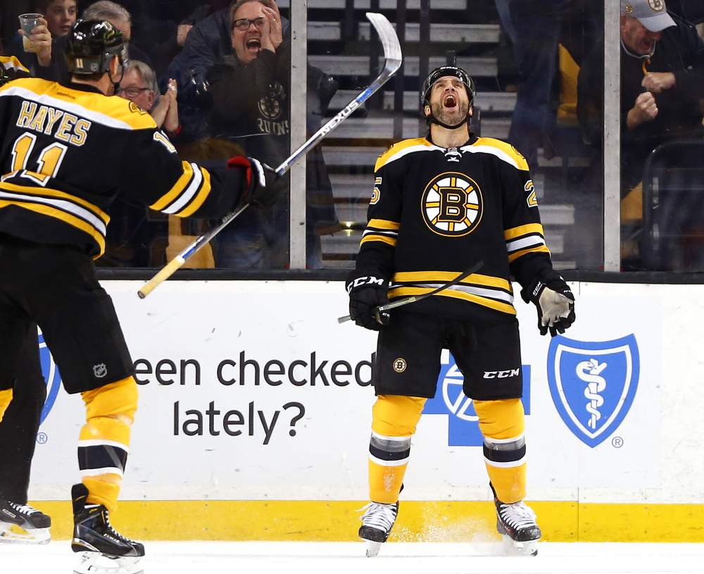 The Bruins’ Max Talbot celebrates his first-period goal against the Penguins with teammate Jimmy Hayes. The goal was all Boston needed as it shut out Pittsburgh, 3-0.
