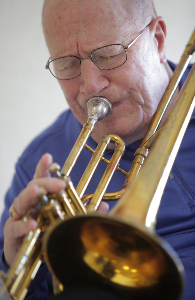 Trombonist Don Doane practices at the Maine Veterans’ Home in Scarborough last year. He died Wednesday at 84.