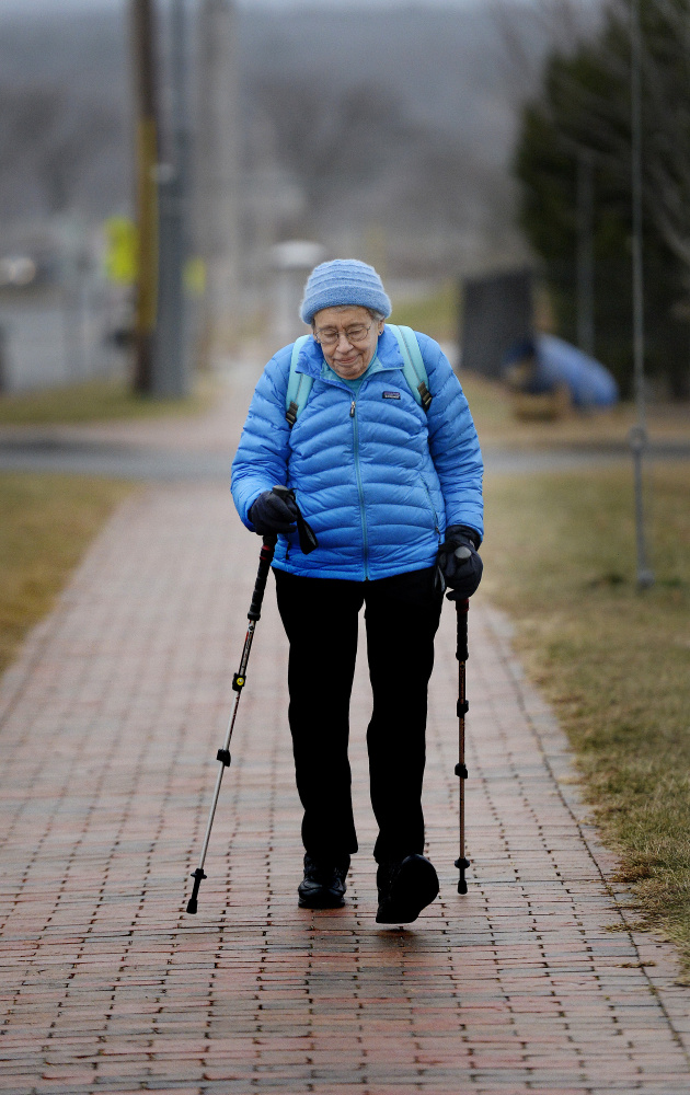 Bobbi Keppel, an advocate for pedestrians and elders, uses trekking poles on a brick sidewalk on North Street in Portland. She says the pole tips sometimes get caught between bricks, and that wet leaves, ice and uneven bricks add to the hazards of brick sidewalks.
Shawn Patrick Ouellette/Staff Photographer