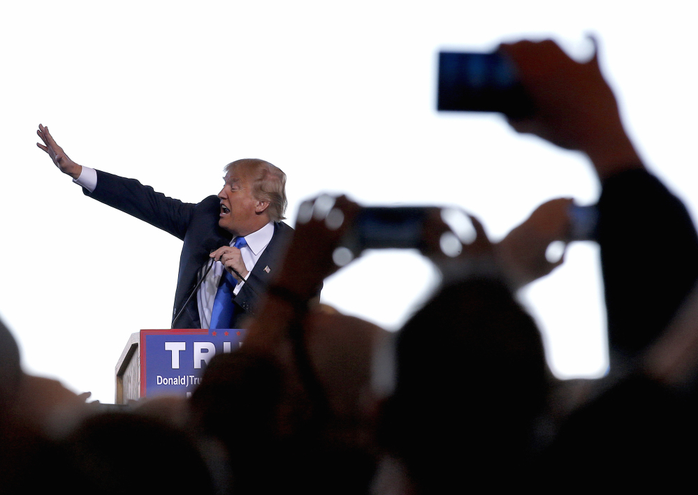 Republican presidential candidate Donald Trump gestures as he speaks at a campaign rally, Wednesday, Dec. 16, 2015, in Mesa, Ariz. (AP Photo/Ross D. Franklin)