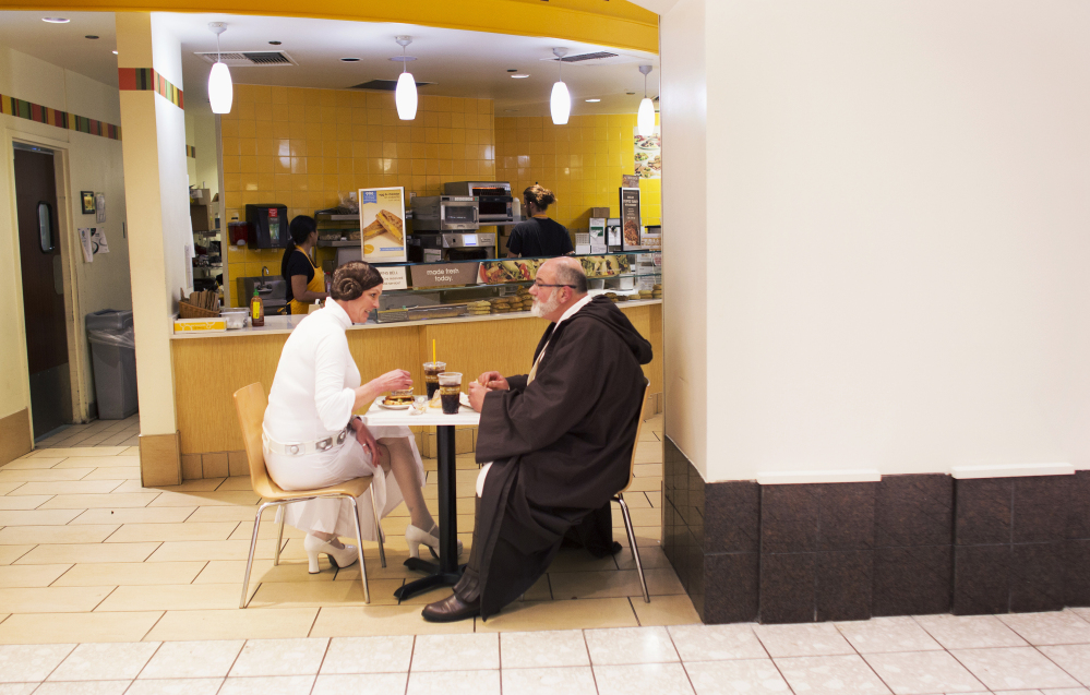Bonta and Fred Cunningham, dressed as Princess Leia and Obi-Wan Kenobi, grab something to eat at the MacArthur Center food court in Norfolk, Va., before seeing the showing of “Star Wars: The Force Awakens” on Thursday.