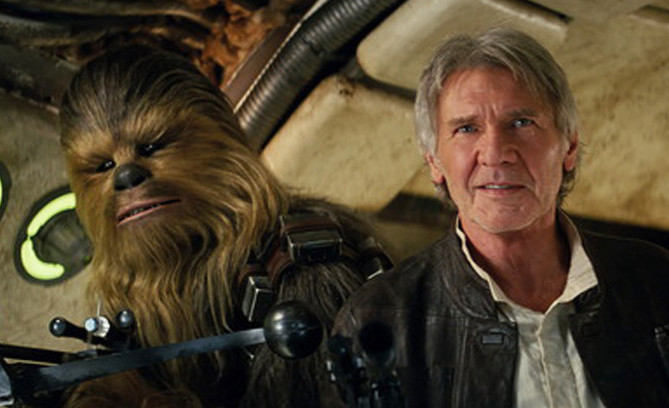 Peter Mayhew plays Chewbacca and Harrison Ford is Han Solo in “Star Wars: The Force Awakens.”