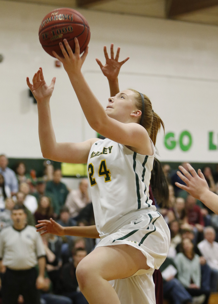 McAuley’s Eva Mazur goes in for a layup in the second quarter Friday night against Thornton Academy. The Lions improved to 5-0 and handed Thornton its first loss. Joel Page/Staff Photographer