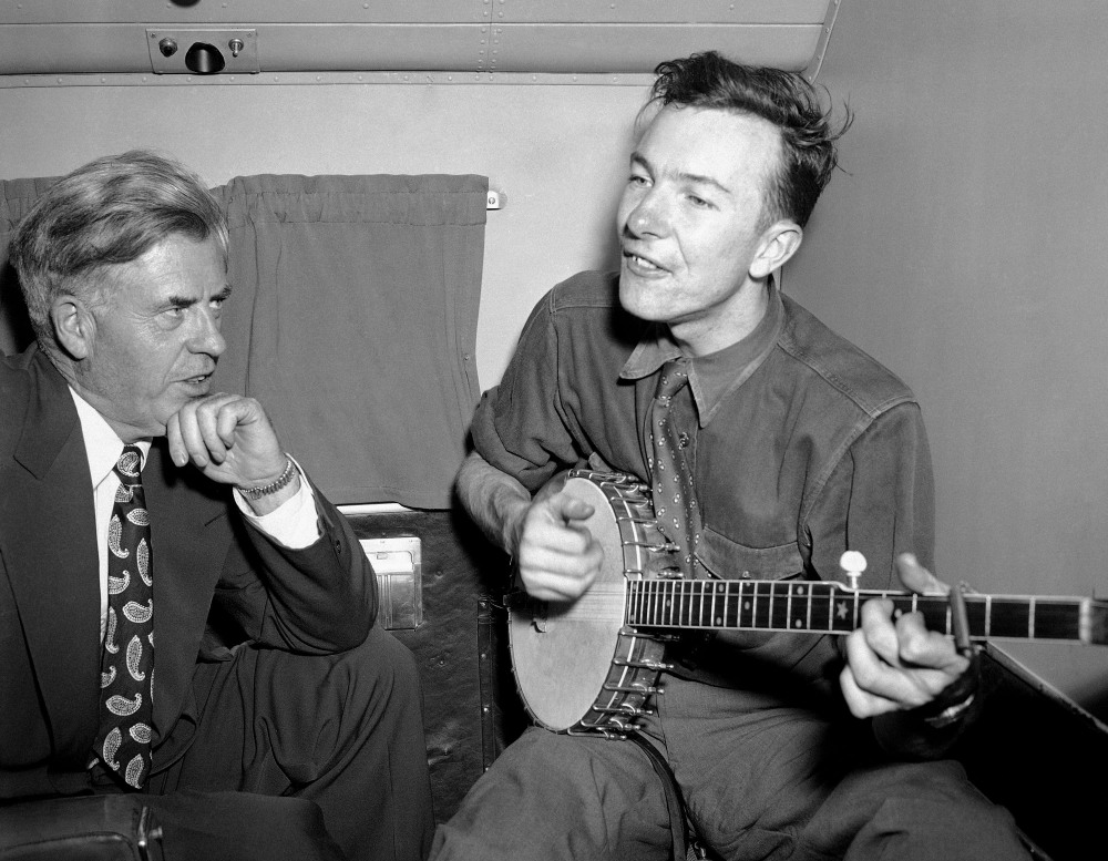 Henry A. Wallace, Progressive Party presidential hopeful, listens to Pete Seeger in August 1948. The FBI released more than 1,700 pages of documents about Seeger in 2014.