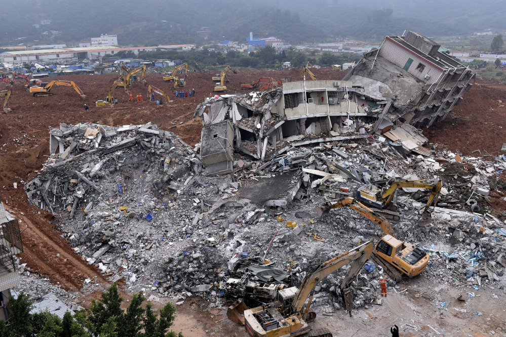 Nearly 3,000 people were involved in rescue efforts in Shenzhen, China, after a man-made mountain of dirt, cement chucks and construction waste came sliding down Sunday. The government said Monday 85 people were missing. The Associated Press 