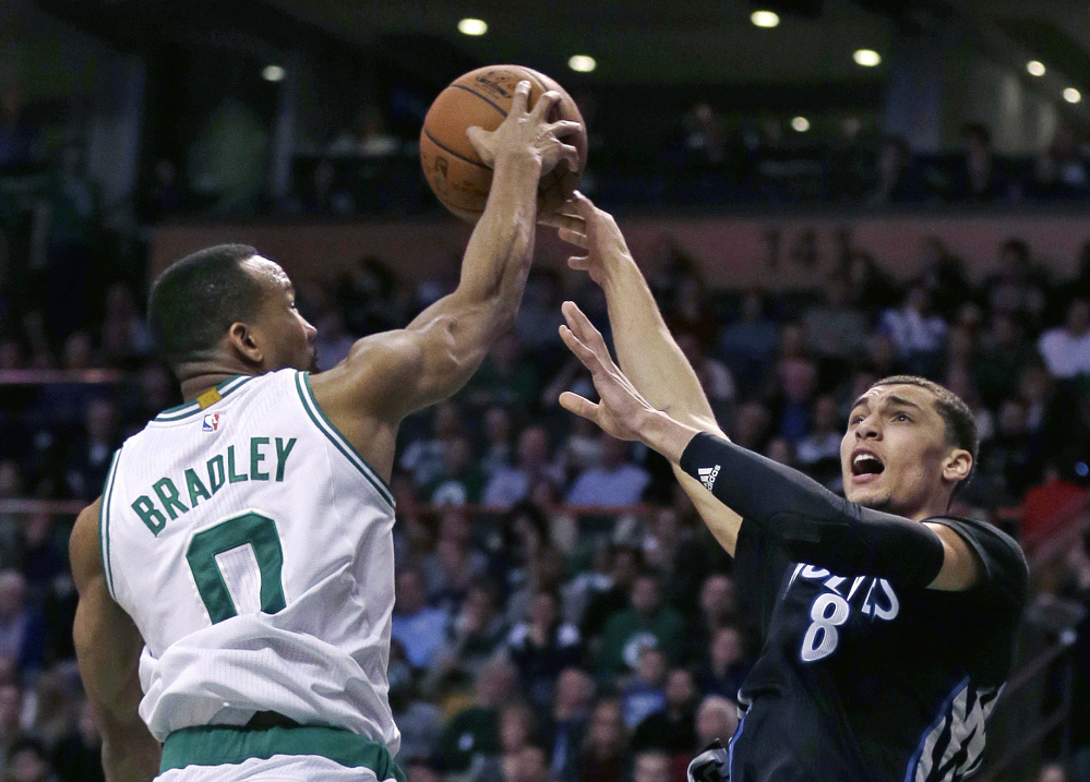 Celtics guard Avery Bradley blocks a shot by Timberwolves guard Zach LaVine in the second half of Monday night’s game. Boston won, 113-99.