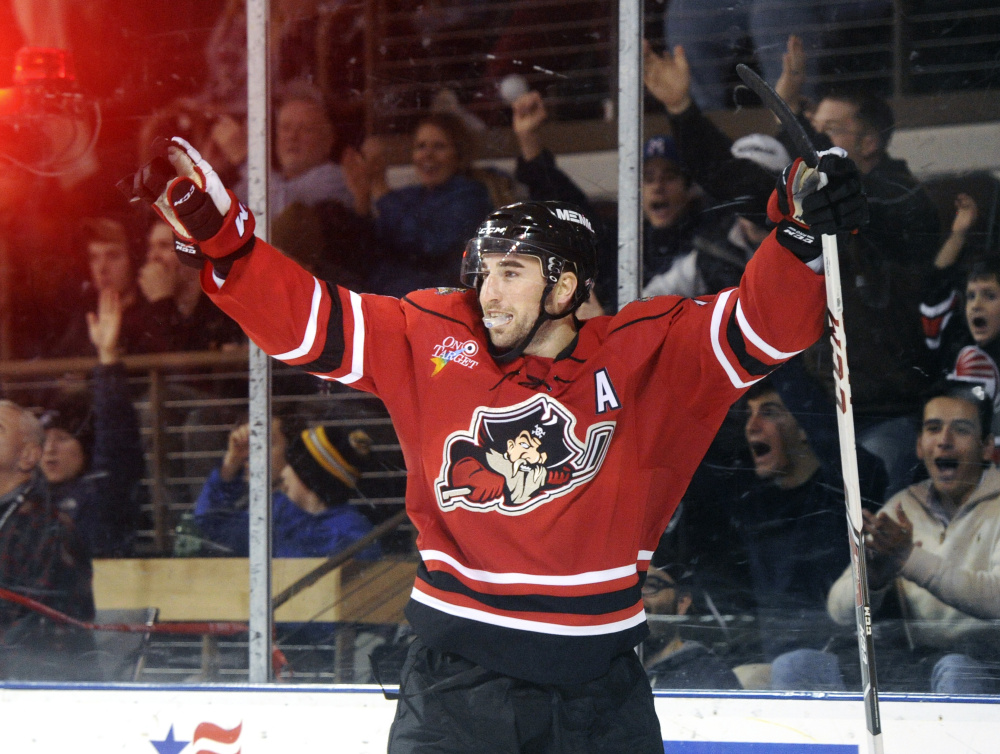 Garrett Wilson celebrates after scoring a goal for the Portland Pirates, tying the game 2-2 and helping spark a comeback and a 4-2 win over Providence on Tuesday night.