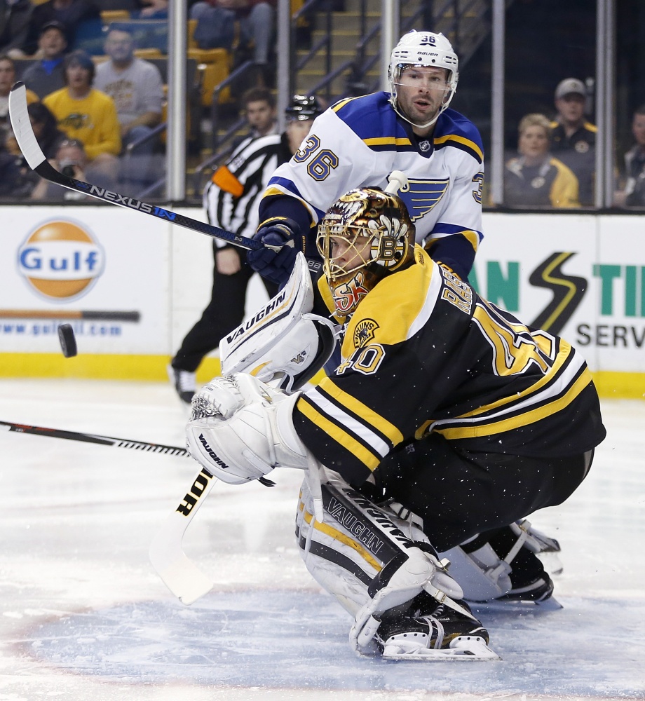St. Louis’ Troy Brouwer watches his shot rebound off Bruins goalie Tuukka Rask in the scoreless first period Tuesday night.