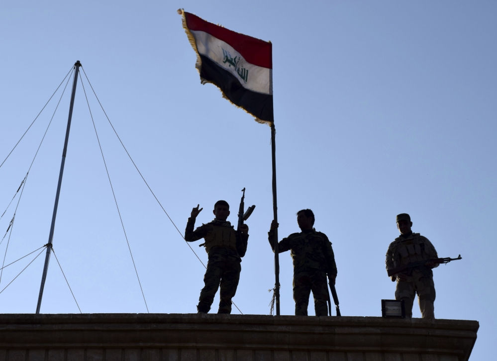 On Monday, Iraqi soldiers planted the national flag over a government building in Ramadi as security forces advanced their campaign to retake the city from the Islamic State.