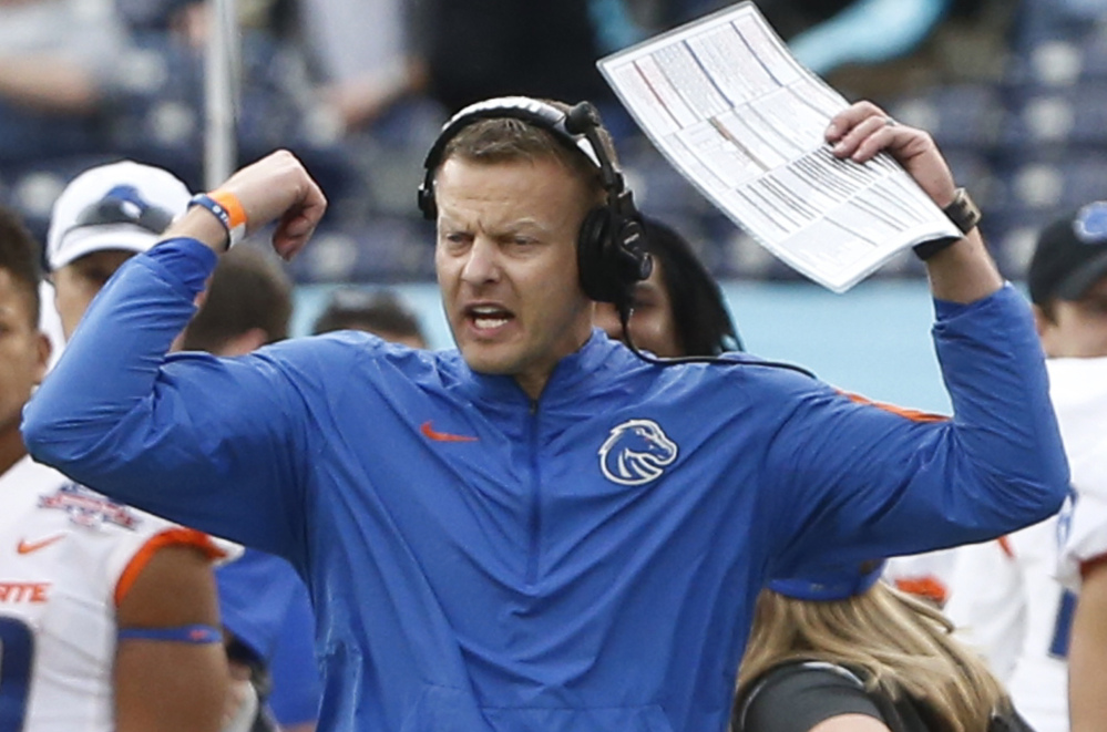 Boise State Coach Bryan Harsin encourages his team Wednesday during the first half of the 55-7 victory against Northern Illinois in the Poinsettia Bowl at San Diego.