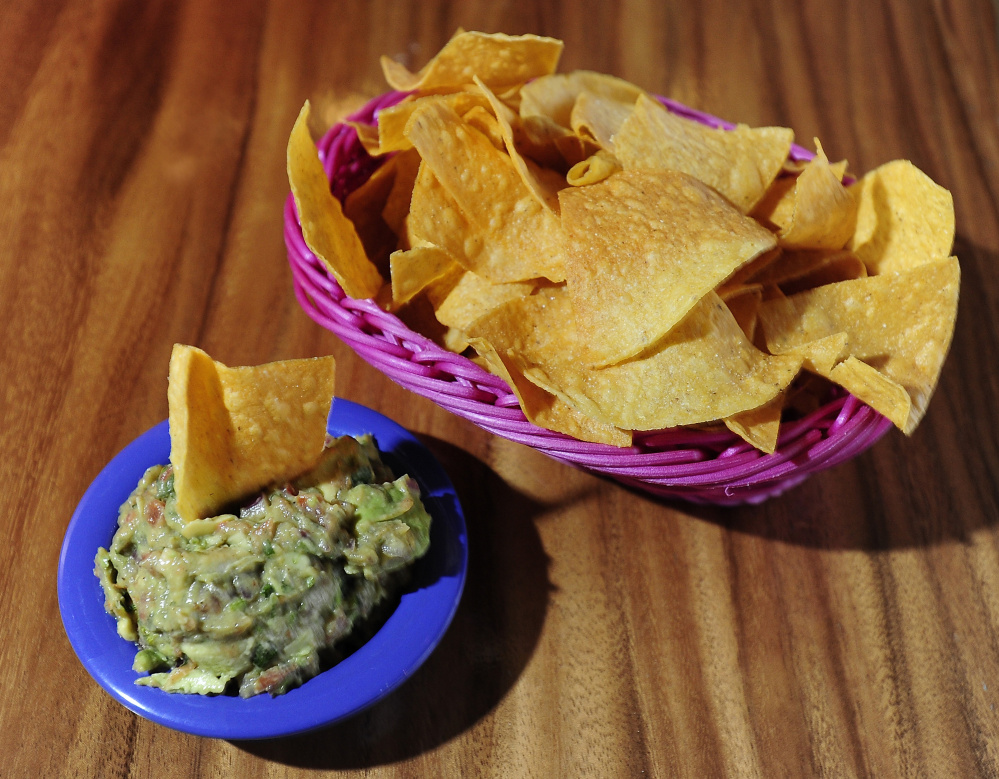 Chips and guacamole whet the appetite with bright, tart flavors and a bit of heat.