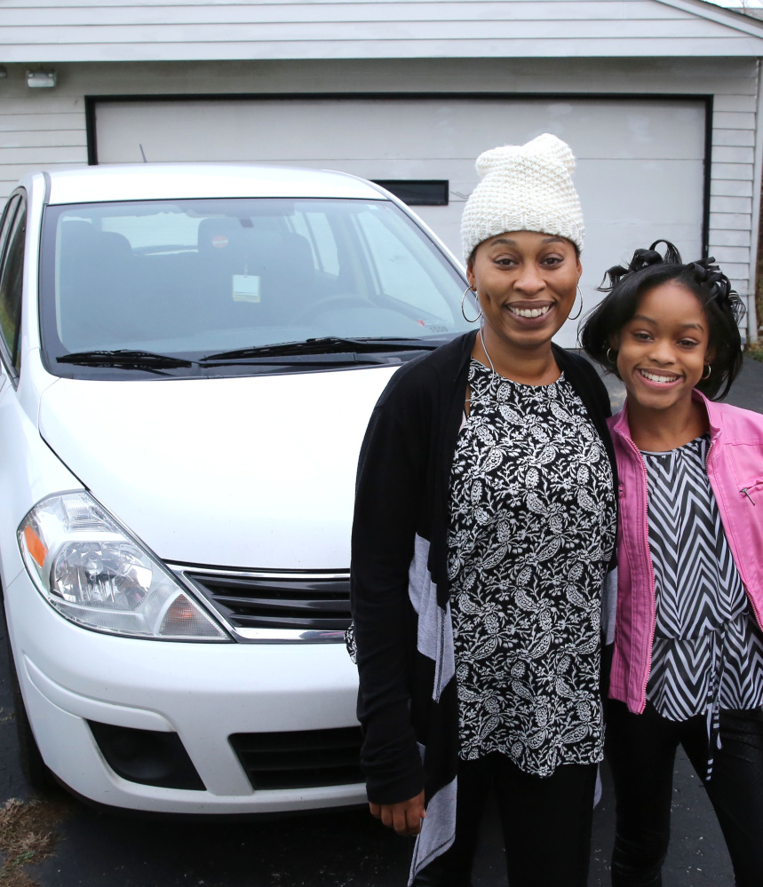 Diana Parks and her daughter Ania are considerably happier in Garfield, Ohio, after a planned repossession of their 2011 Nissan Versa became an uplifting Christmas story instead. 