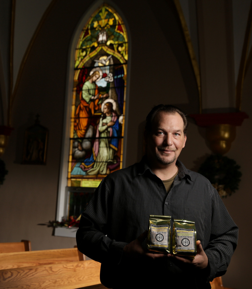 Ryan Bambrick, owner of Northwest Indiana Trading Co., holds bags of frankincense and myrrh that his company sells along with essential oils and ginseng.