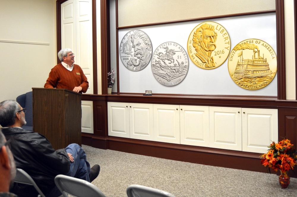 Henry Sweets, executive director of the Mark Twain Boyhood Home & Museum in Hannibal, Mo., unveils the design for commemorative gold and silver Mark Twain coins that will be sold starting next year. Some of the proceeds of the coin sales benefit four Twain-related sites, including the Hannibal home and museum.