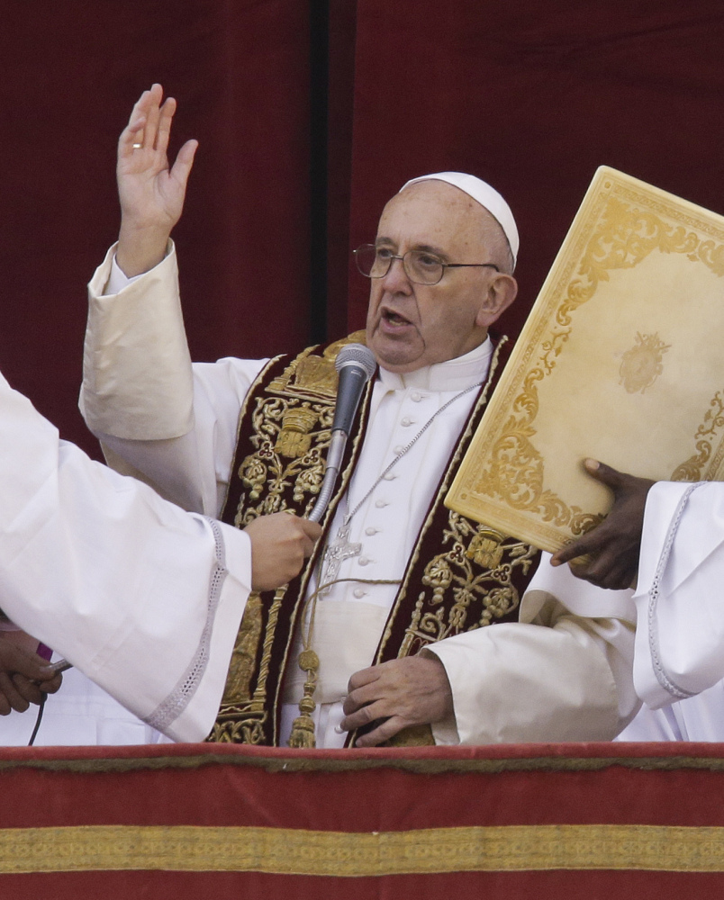 Pope Francis delivers his “Urbi et Orbi” blessing from St. Peter’s Basilica on Christmas Day.