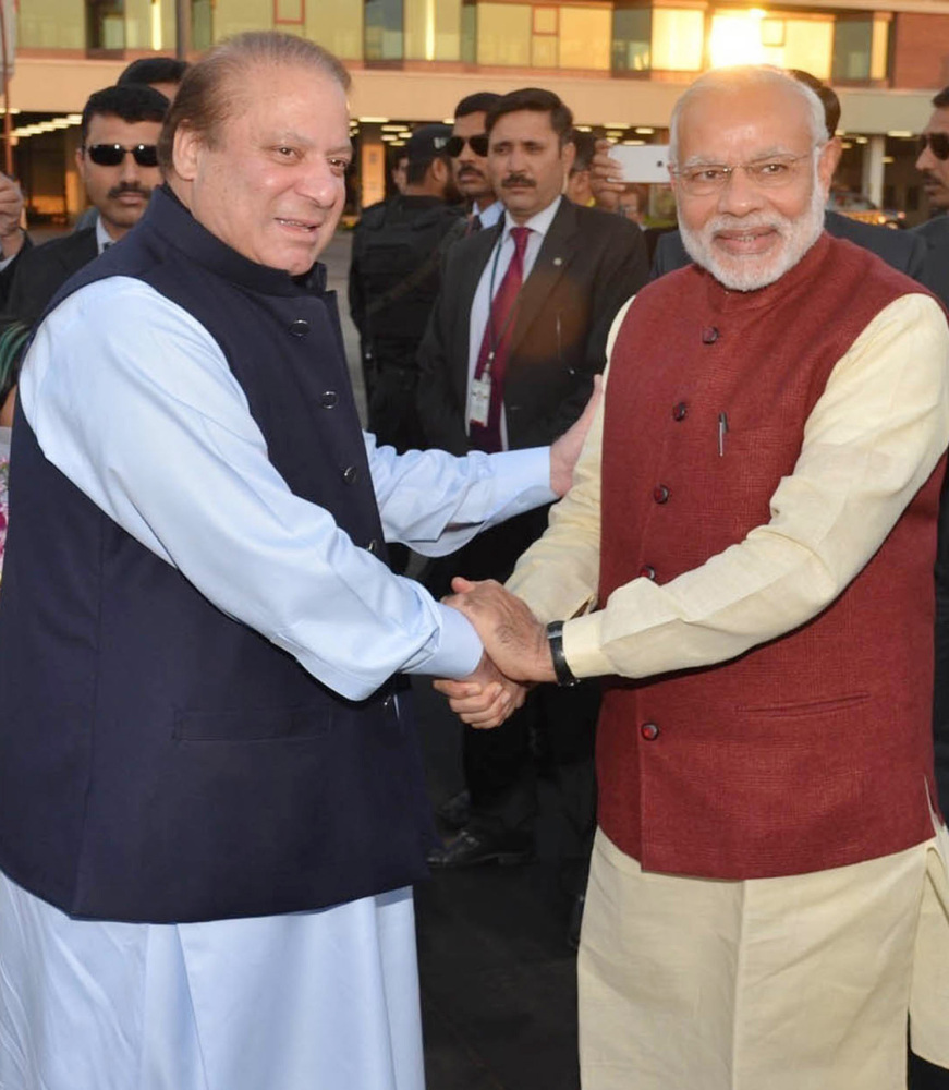India’s Prime Minister Narendra Modi, right, dropped in on his Pakistani counterpart, Nawaz Sharif, in Lahore on Friday. Analysts say the surprise visit bodes well for  relations between the two countries.
