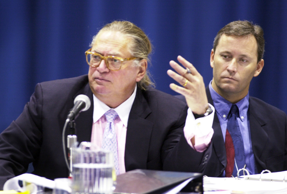 Shawn Scott, right, listens as one of his attorneys, Martin Gersten, questions a witness at a licensing hearing in 2003. Scott has faced numerous lawsuits over business dealings. 2003 Press Herald File Photo