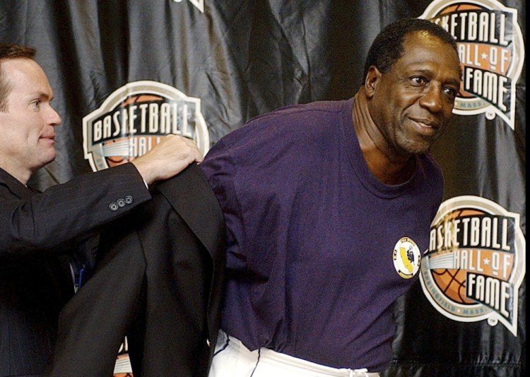 In this 2003 file photo, Basketball Hall of Fame CEO John Doleva, left, presents a Hall of Fame jacket to inductee Meadowlark Lemon of the Harlem Globetrotters in Springfield, Mass.
