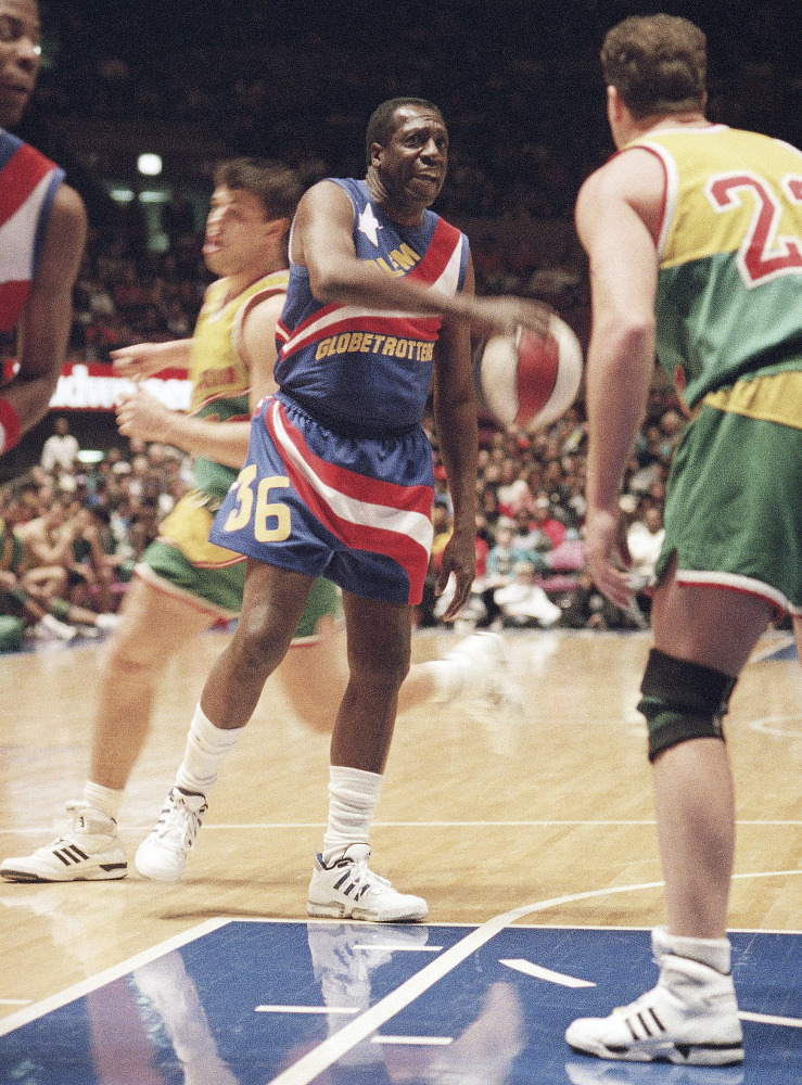 In this 1993 file photo, legendary Harlem Globetrotters’ Meadowlark Lemon prepares to put the moves on Washington Generals’ Tim Burkhart at Madison Square Garden in New York.