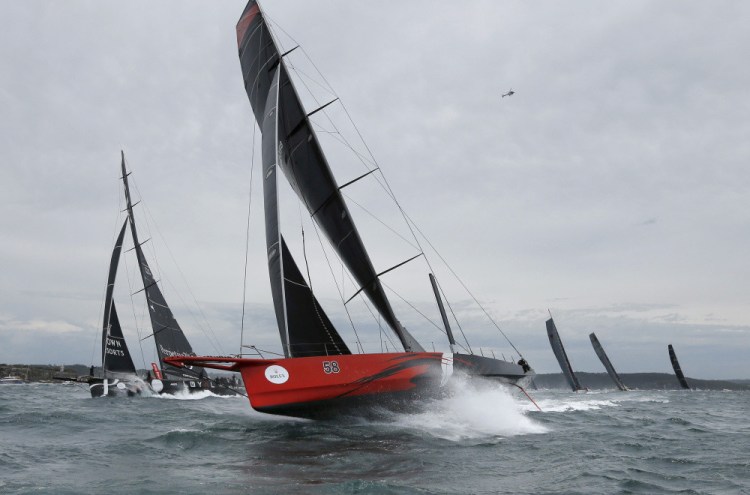 Comanche, center, shown in Sydney Harbor during the 71st Sydney to Hobart Yacht race in 2015, has broken a trans-Atlantic crossing record.