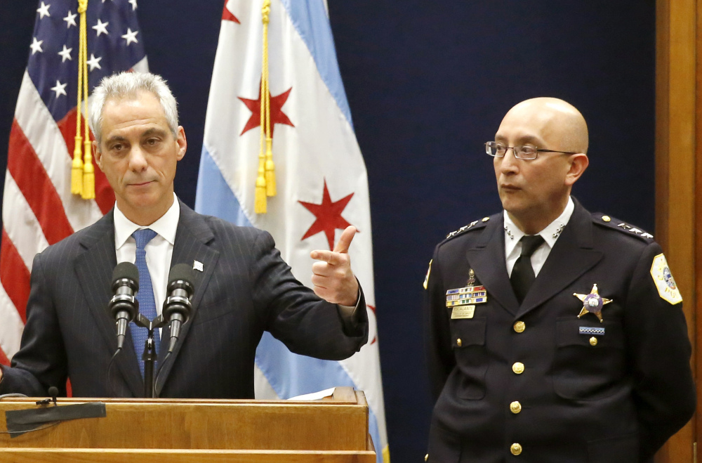 Chicago Mayor Rahm Emanuel, accompanied by Interim Chicago Police Superintendent John Escalante, speaks during a news conference in Chicago on Dec. 7. 