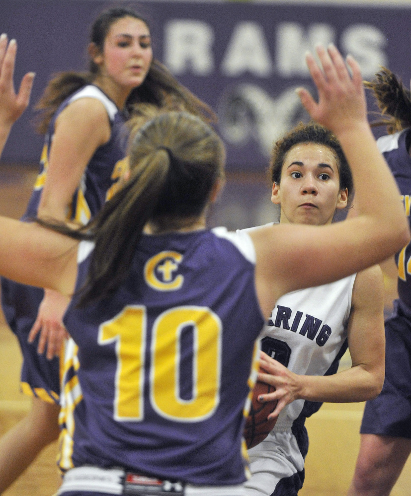 Abby Ramirez, who scored 15 points Wednesday for Deering, looks to penetrate while guarded by Ally Tillotson of Cheverus. Deering won, 59-42.