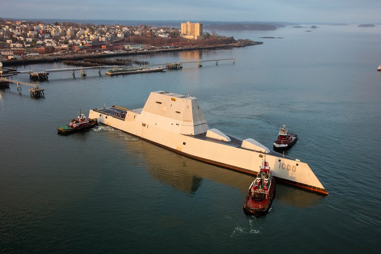 Tugboats turn the Zumwalt as it arrives unannounced in Portland Harbor in December during sea trials.
<em>Photo by Dave Cleaveland Maineimaging.com </em>