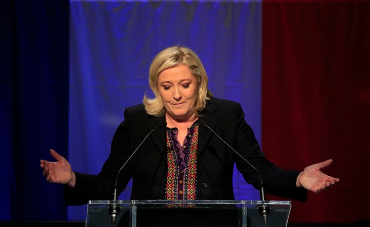 Far Right National Front party leader Marine Le Pen delivers her speech after the results of the second round of the regional elections.
