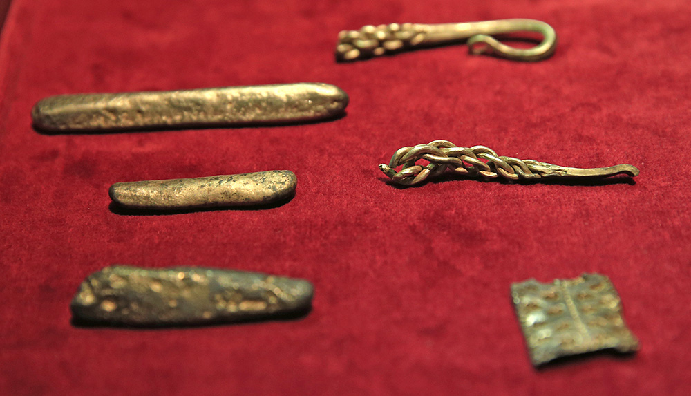 The hoard contains 186 coins, seven items of jewelry and 15 ingots of gold and silver. The Associated Press