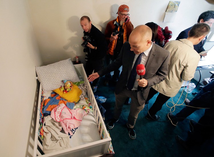 Members of the media crowd into a child's room in the apartment where Syed Farook and Tashfeen Malik lived. Live broadcasts from the apartment Friday drew criticism.
The Associated Press
