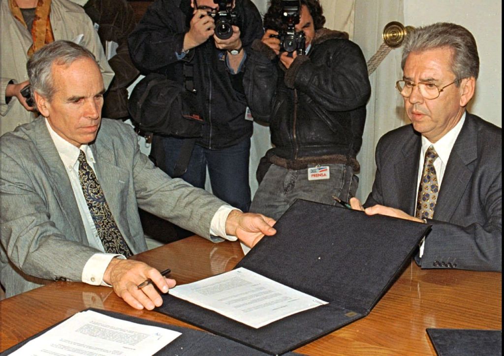 American millionaire Douglas Tompkins, left, and Juan Villarzu, chief of staff of the Chilean president, hold the text of an accord signed in Santiago, Chile, in this this July 7, 1997, photo. The Associated Press