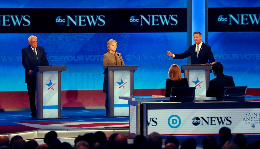 Martin O’Malley, right, speaks alongside Bernie Sanders and Hillary Clinton during a Democratic presidential primary debate Saturday at St. Anselm College in Manchester, N.H. The Associated Press