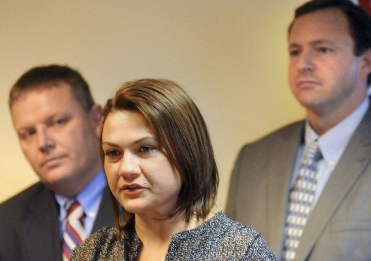 Portland resident Julie Lawson discusses her struggle with drug addiction while flanked by Senate President Mike Thibodeau, R-Winterport, left, and Speaker of the House Mark Eves, D-North Berwick, during a news conference Wednesday in Augusta. Andy Molloy/Kennebec Journal Staff Photographer