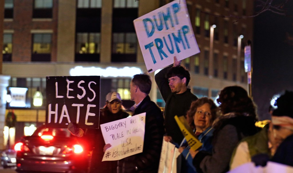 Protestors picket before Donald Trump's address to a regional police union in Portsmouth, N.H., on Thursday night.
The Associated Press