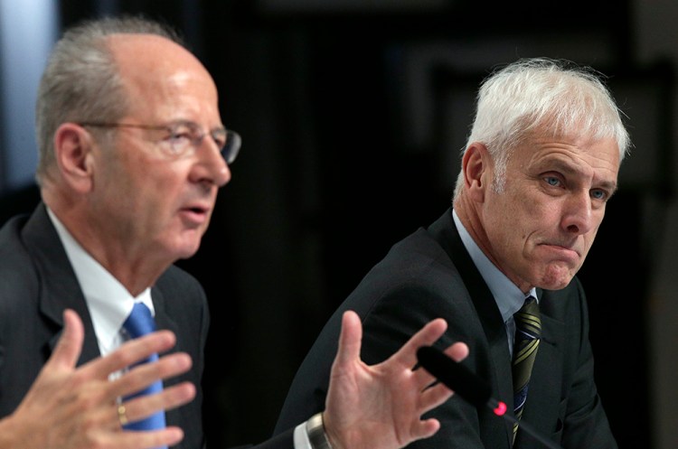 Hans Dieter Poetsch, chairman of the board of directors of  Volkswagen, left, and Matthias Mueller, CEO, address the media during a news conference  in Wolfsburg, Germany, Thursday. The Associated Press