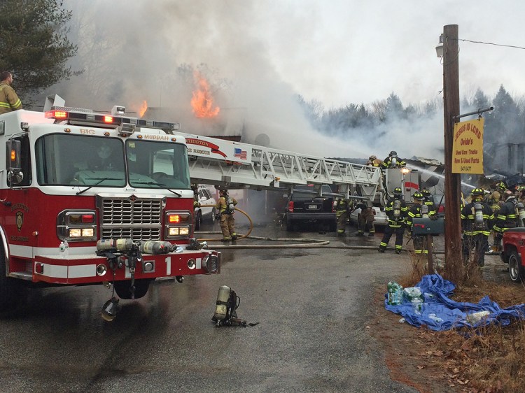 A portion of Route 302 was shut down to allow fire trucks to knock down the flames. John Ewing/Staff Photographer