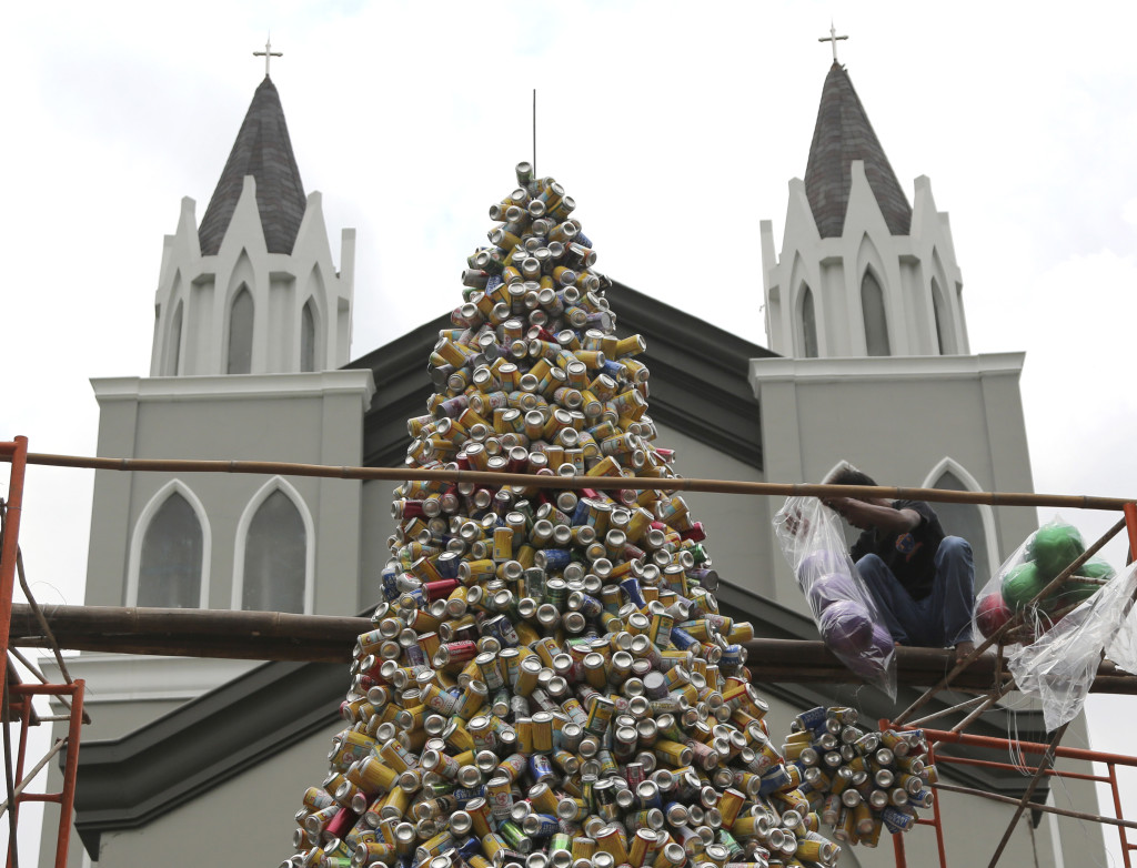 With the tree completed, the decorations are added. After Islam, Christianity is Indonesia's second-largest religion.