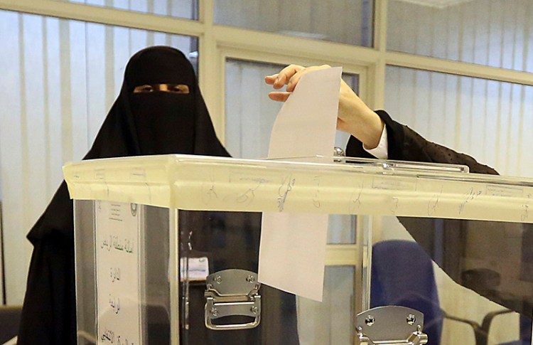 A Saudi woman votes at a polling center in Riyadh.