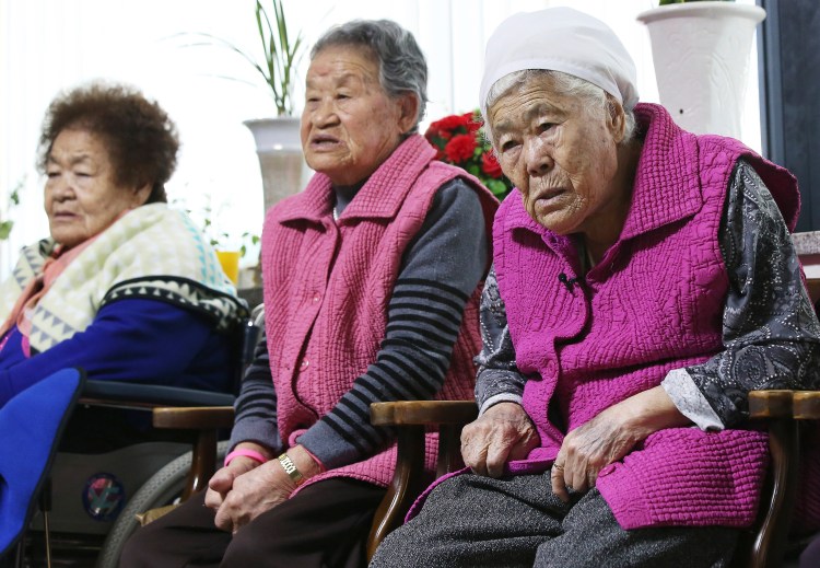 Former South Korean sex slaves, who were forced to serve for the Japanese army during World War II, wait for results of a meeting of South Korean and Japanese foreign ministers at the Nanumui Jip, The House of Sharing, in Gwangju, South Korea, Monday. Hong Ji-won/Yonhap via AP