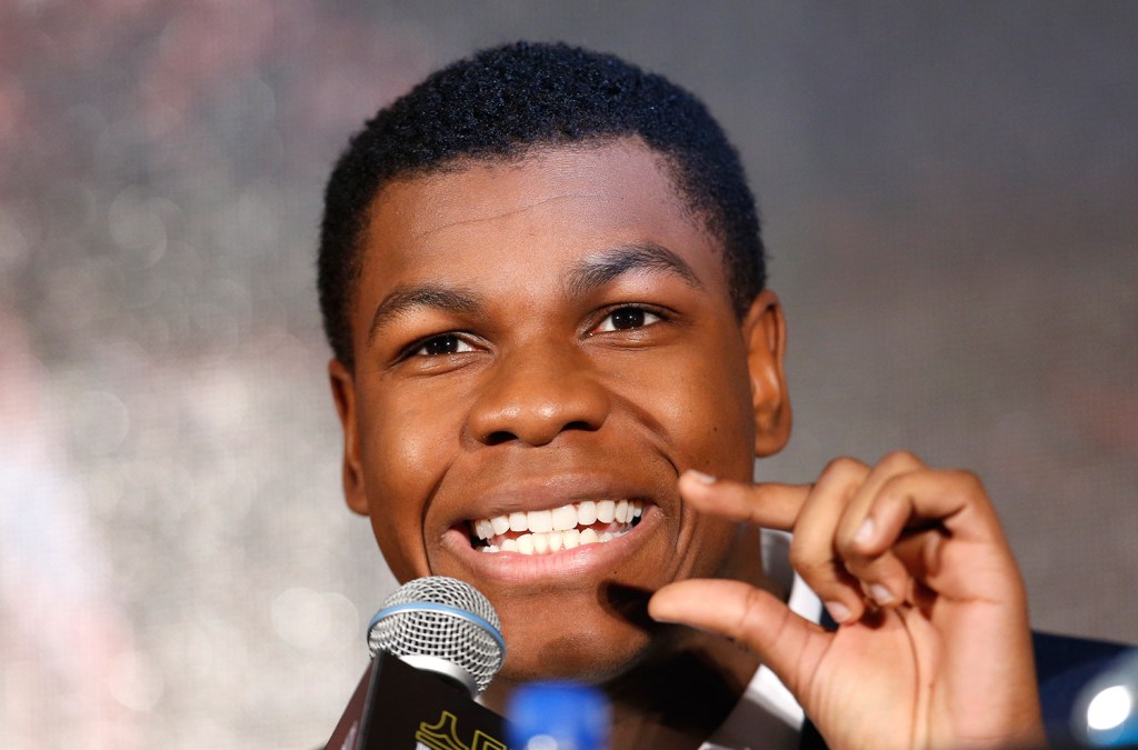 Actor John Boyega answers a reporter's question during a press conference for "Star Wars: The Force Awakens," in Seoul, South Korea. The movie is to be released in South Korea on Dec. 17.