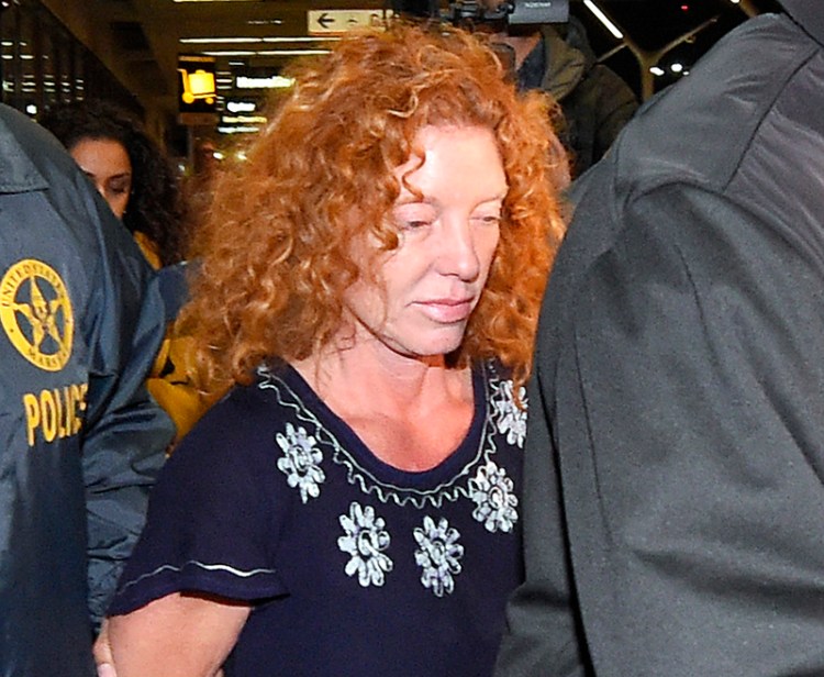 Tonya Couch, center, is taken by authorities to a waiting car after arriving at Los Angeles International Airport on Dec. 31. Couch was expected to appear in a Los Angeles courtroom Tuesday for a hearing that could send her back to Texas. The Associated Press